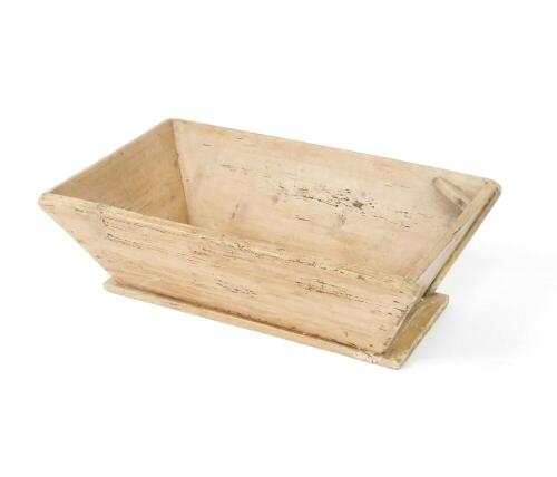 A French pine dough trough, of rectangular section with sloping sides, raised on a plinth base, 26cm H, 83cm W, 48cm D.