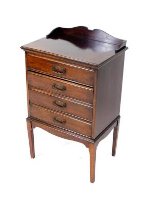 A Victorian mahogany music chest, with a galleried back, over four drop front drawers, raised on tapering square legs, 84cm H, 50cm W, 35.5cm D.