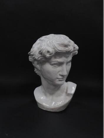 A white glazed pottery bust of David, after Michelangelo, 37cm H.