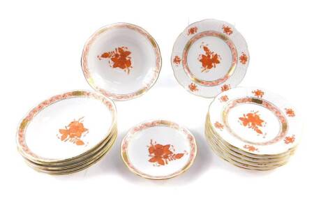 A group of Herend porcelain decorated in the Orange Red Apponyi pattern, comprising six tea plates and saucers, and a spoon dish.