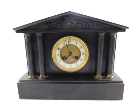 A late 19thC French slate mantel clock, circular brass dial, with enamel chapter ring bearing Arabic numerals, eight day movement by J Marti & Cie with coil strike, the case of architectural form, raised on four fluted pillars and a rectangular base, with