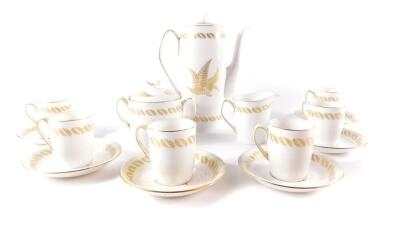 A Spode porcelain part coffee service, decorated in the Golden Fern pattern, comprising coffee pot, sucrier, cream jug, six cups and saucers.