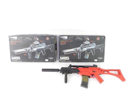 Two M85 electric power Airsoft guns, with 6mm BB bullets, boxed.