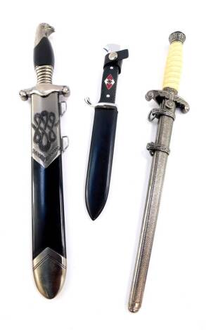 Three Third Reich replica daggers, comprising an RAD, Reichsarbeitsdienste dagger, Wehrmacht, and a Hitler Youth knife 'Blut Und Ehre'.