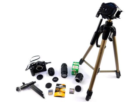 A Nikon FM2 camera, with an MD - 11 motor drive, zoom and other lenses, and a Hama camera tripod. (qty)