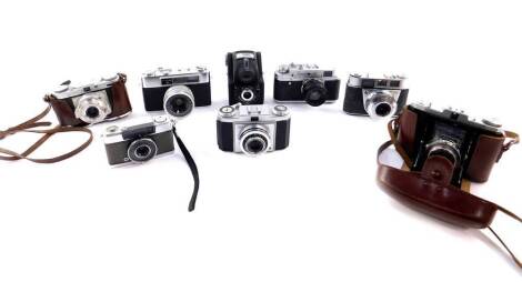 A group of cameras, including a Zorki - 4 camera, two Zeiss Ikon cameras, Edixa Wirgin camera, and a Yashica Minister III camera. (8)