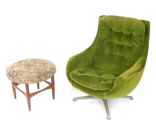 A 1960s/1970's swivel egg chair, probably Parker Knoll, upholstered in green buttoned back fabric, with loose cushions to seat, raised on a metal X frame base, together with a G-Plan teak stool, with circular tapestry seat, Danish design by Ib Kofod-Larse