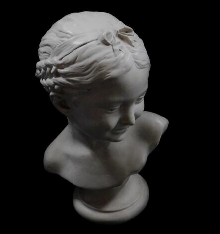 A plaster bust of a girl, with corn braids and ribbons in her hair, on a circular socle base, 34cm H.