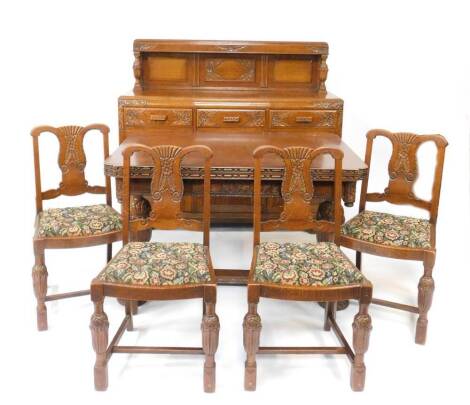 A 1930's oak dining suite, comprising a bow front panel back sideboard, with three floral carved drawers above three panelled doors carved with arches and flowers, raised on scroll block feet, 132cm H, 151cm W, 56cm D., a draw leaf dining table, with flo