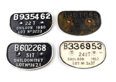 Four Shildon cast iron railway wagon plates, comprising B336953 24 1/2T Shildon 1962 Lot No 3437, B935462 22T Shildon 1960 Lot No 3223, B351845 32T Shildon 1966 Lot No 3528, and B602268 51T Shildon 1967 Lot No 3621.