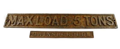 A cast iron max load 5 tons sign, 11.5cm H, 84cm W., together with a cast iron Gainsborough sign, 5cm H, 45cm W. (2)