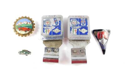 Two Monza Autodromo car badges, XVII Grand Criterium Des Alpes - Etape Des Dolomites 1954 badge, Rover car badge, and a lapel badge. (5)