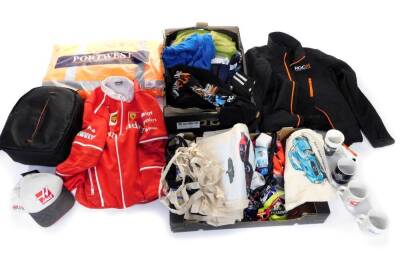 Racing memorabilia, including Goodwood Revival Meeting tote bags, hat holders, mugs, Hars F1 Team cap, indistinctly signed, ROC Race of Champions jacket, Hi-Viz jacket, further clothing relating to motor sports, etc. (2 boxes)