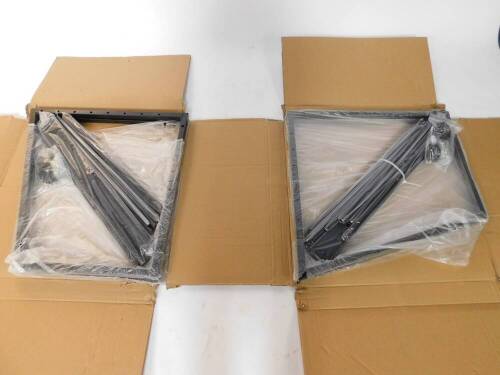 Two car wheel wall mounted storage racks, boxed.