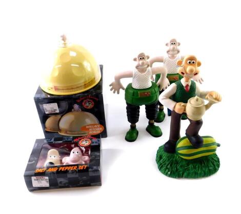 Wallace & Gromit collectibles, comprising Wallace garden ornament, two Wallace Bath & Shower Gel bottles (empty), Salt and Pepper Set, and Wallace Kitchen Scales. (5)