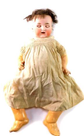 An Armand Marseilles bisque head doll, A.14.M, 990, 65cm H. (A/F)