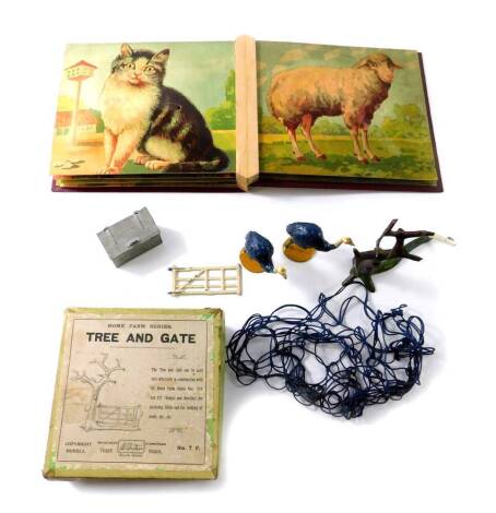 A Britains Home Farm Series Tree and gate set, No.7F, boxed, two J.Hill & Co lead ostrich figures, and an early 20thC German children's animal noise book by AMA. (4)