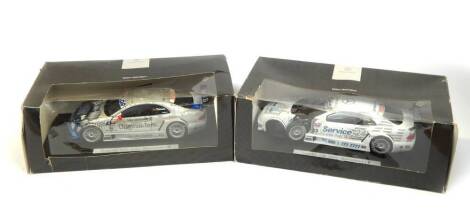 Two Mercedes Benz CLK die cast motor racing cars, 1:18 scale, comprising Original - Teile AMG Mercedes CLK., and a Service 24h AMG Mercedes CLK, both boxed.