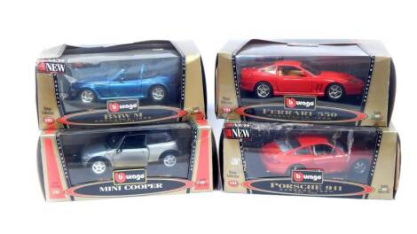 Four Burago Bijoux Collection die cast cars, 1:24 scale, comprising Mini Cooper., Porsche 911 Carrera (1997)., BMW M Roadster (1996)., and Ferrari 550 Maranello (1996), all boxed.