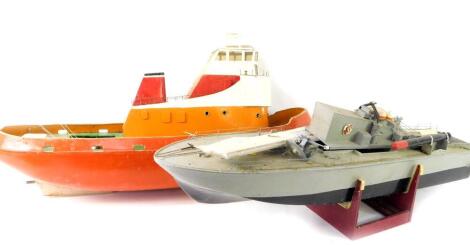 Two kit built remote control model boats, lacking electronics. (AF)