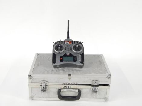 A Spectrum DX6i six channel transmitter, with travel case.