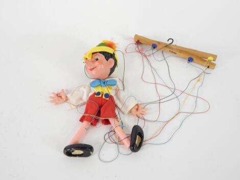 A Pelham Puppet Pinocchio puppet, boxed.