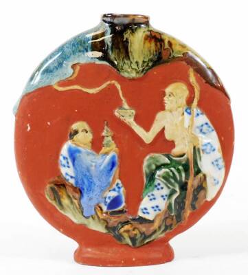 A small early 20thC Japanese Sumidagawa pottery moon flask, decorated with raised figures, 13cm H.