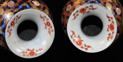 A pair of Meiji period Japanese Imari vases, each of baluster form, profusely decorated with panels, scrolls and flowers in orange and blue with gilt highlights, 30cm H. (2) - 5