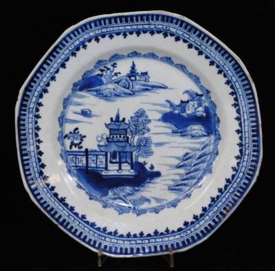 A Chinese blue and white porcelain dish, decorated with a kylin among clouds within a scrolling peony border, the reverse with further scrolling peony designs, another Chinese blue and white dish with peacock, bamboo and prunus, 23cm Dia. an octagonal Chi - 7