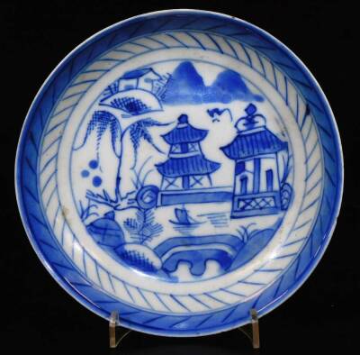 A Chinese blue and white porcelain dish, decorated with a kylin among clouds within a scrolling peony border, the reverse with further scrolling peony designs, another Chinese blue and white dish with peacock, bamboo and prunus, 23cm Dia. an octagonal Chi - 10