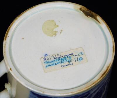 An early 19thC small pottery tankard, printed in blue and white with a thatched cottage pattern, c1825, 7.5cm H. (chip to foot rim) - 5