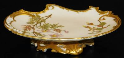 A Royal Worcester blush ivory low comport, decorated with flowers with a pierced rim, shape code 1426, 1891, 22cm Dia.