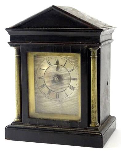 A 19thC library timepiece, in ebony case, with silvered dial, flanked by brass pillars, glazed door to reverse, lacking feet (AF), 13cm H.