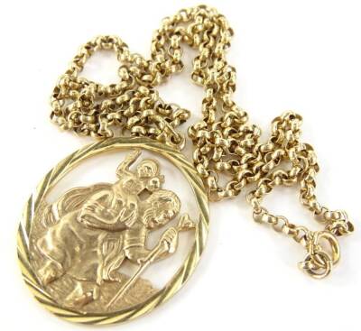 A 9ct gold St Christopher pendant and chain, the oval pendant with religious scene, on a curb link chain, 23.1g all in.