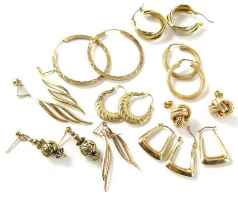 A selection of 9ct gold and other earrings, comprising a four pairs of hoops, knot earrings, two fern drop earrings, three loose earrings, and a pair of drop design earrings, 19.6g all in.