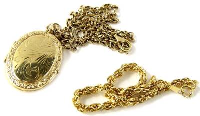 A 9ct gold pendant and chain, with oval floral scroll locket, marked 375, on a curb link chain, marked 375, 9.1g all in, and a gold plated bracelet. (2)