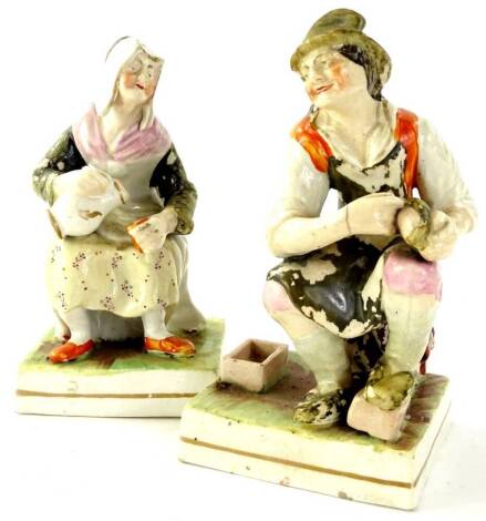 A pair of 19thC Staffordshire figures of cobblers, each polychrome decorated on square gilt line bases, unmarked, 18cm H.