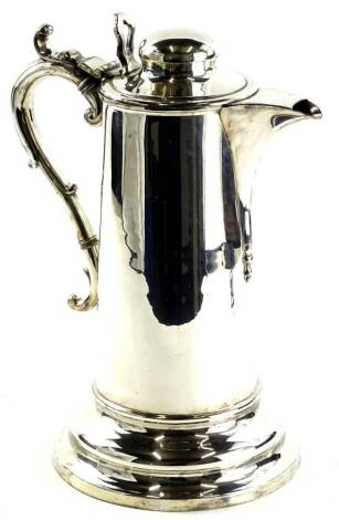 A Broadhead & Atkin silvered metal tankard, of large proportion, the compressed orb knop, with pierced thumb piece and circular lid with plain spout, elaborate handle and plain tapering cylindrical body on a circular base, marked to the underside, 31cm H.