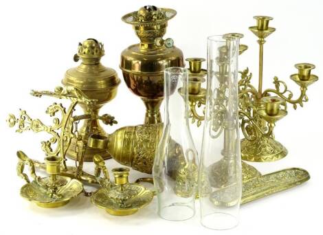 Various brassware, to include elaborate bell with fixed handle, 14cm H, candlesticks, lamps, pair of squat candlesticks, etc. (a quantity)