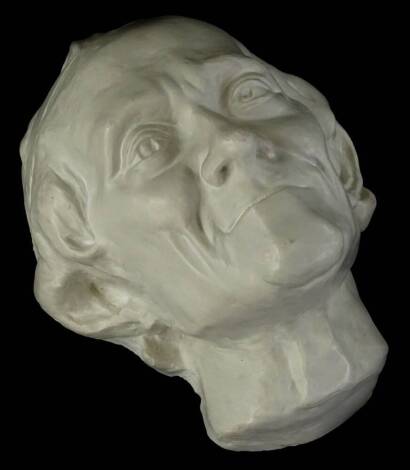 A reproduction plaster Voltaire death mask, with open back, 26cm H.