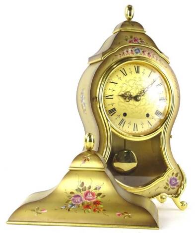 A modern Elusea bracket clock, with a shaped case with glazed front revealing visible pendulum with similar decorative floral stand, fancy 12cm dia Roman numeric dial with two winding holes, the main body 40cm H.