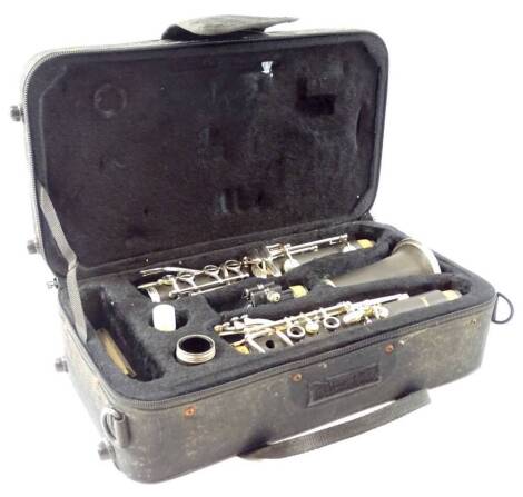 A cased Sonata ebonised clarinet, with chrome plated mounts in fitted case, 35cm W.