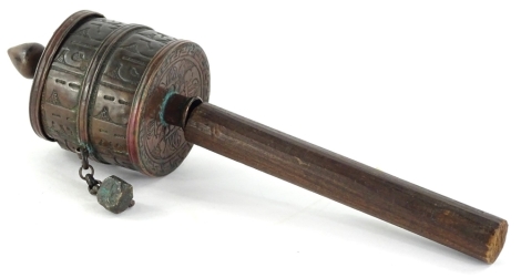 A Tibetan wooden and embossed copper prayer wheel.