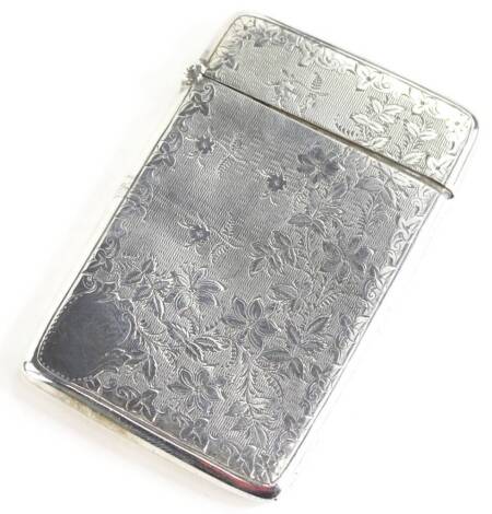 An Edwardian silver card case, with engine turned and bright cut decoration of flowers etc., Birmingham 1903, 1¾oz.