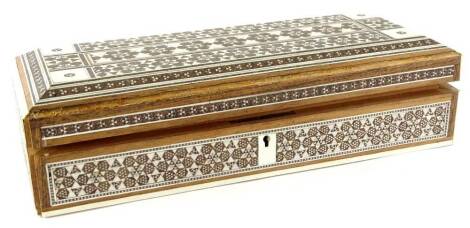 A late 19thC Indian sandalwood, ivory and silver coloured metal inlaid rectangular box, 30cm W.