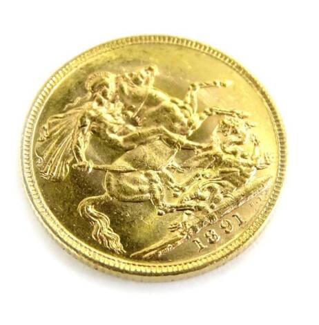 A Queen Victoria full gold sovereign, dated 1891, in coin case.