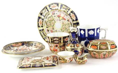 A small collection of Royal Crown Derby, to include a miniature sauce boat, bottle shaped vase, bowl, saucers, plates, cup, box and cover etc.