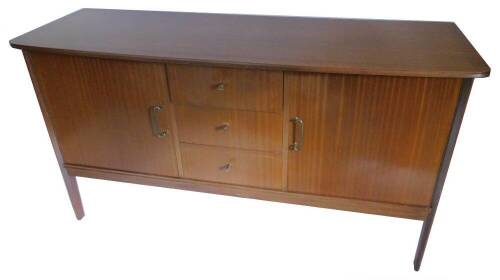 A Vanson retro teak sideboard, with a bow fronted top above three drawers flanked by two doors, each with brass handles on tapering legs, 160cm W.