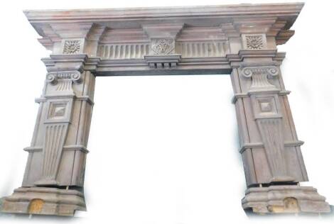 A late Victorian carved oak fire surround, decorated with flutes of patera and stylised columns to each side, dated 1875 and with initials W, probably for William Watkins, (AF), 137cm H, 207cm W. Provenance: Removed from Leyland House, Nettleham Road, Lin