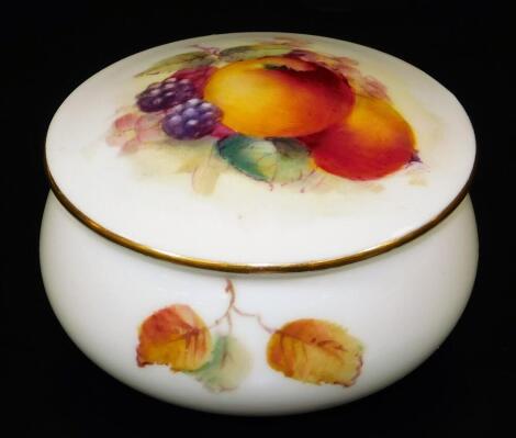 A Royal Worcester porcelain jar and cover, handpainted with autumnal fruits, blackberries and apples with leaves, 1926, printed marks beneath, 7cm Dia.